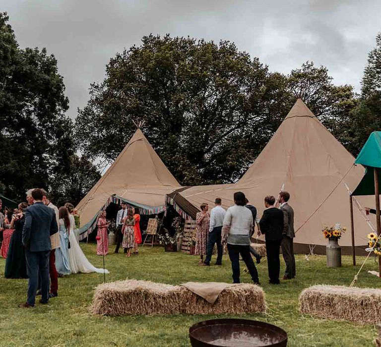 Tipi wedding with DIY decor at festival style wedding