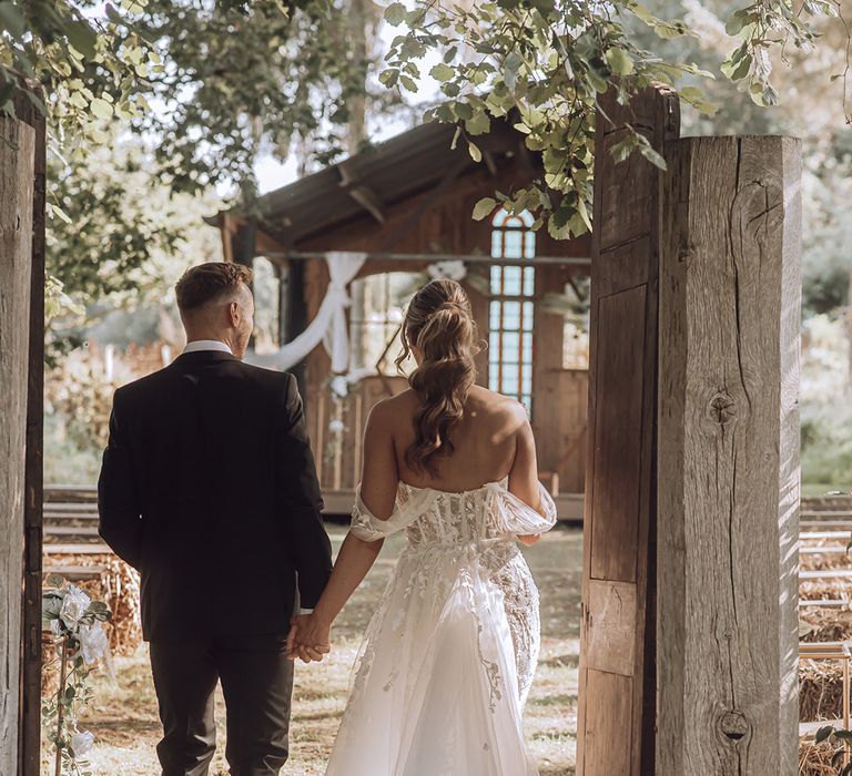 Bride walks with her groom on their wedding day