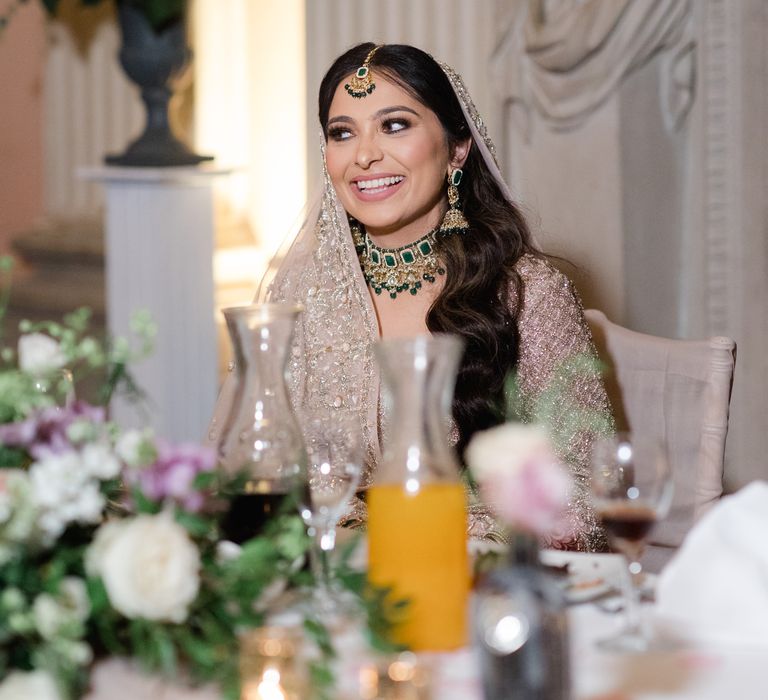 Bride smiles on her wedding day during reception