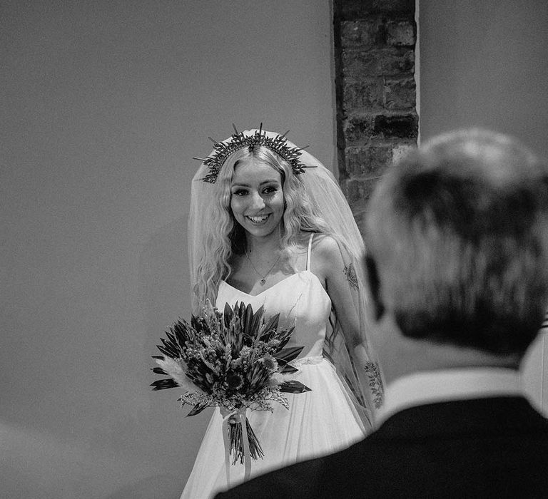 Beautiful bride in gold wedding crown