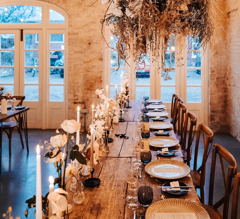 Top table place settings and hanging dried flower installation 