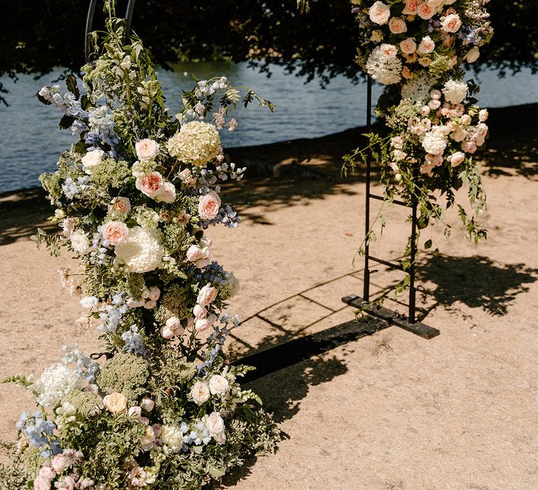 Black steel arch complete with floral decor by the River Thames