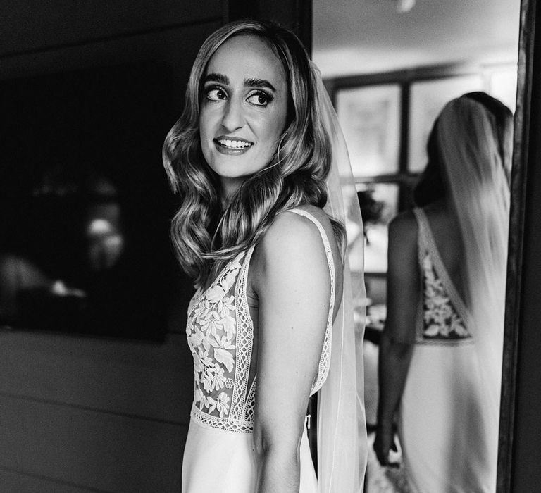 Bride wears appliqué wedding dress in black & white image 