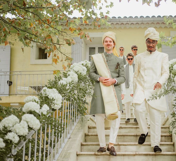 Groom in a cream and green Sherwani and Churidar outfit at Domaine de Blanche Fleur, Provence Hindu wedding 