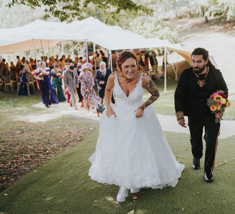 Deer's Leap Retreat wedding with stretch tent ceremony and bride in a lace wedding dress