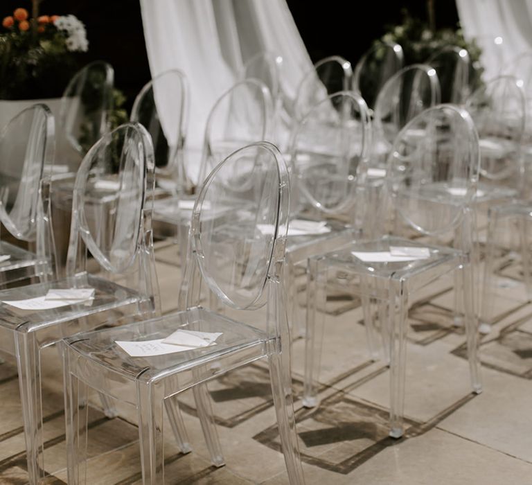 Clear acrylic wedding chairs at outdoor wedding ceremony in London at Devonshire Terrace 