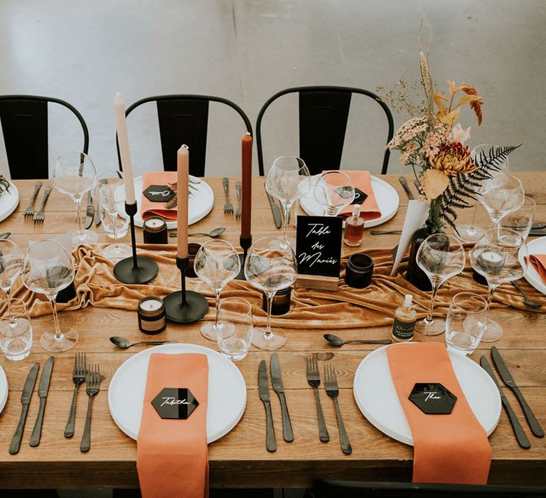 orange and black wedding table decor and place setting details 