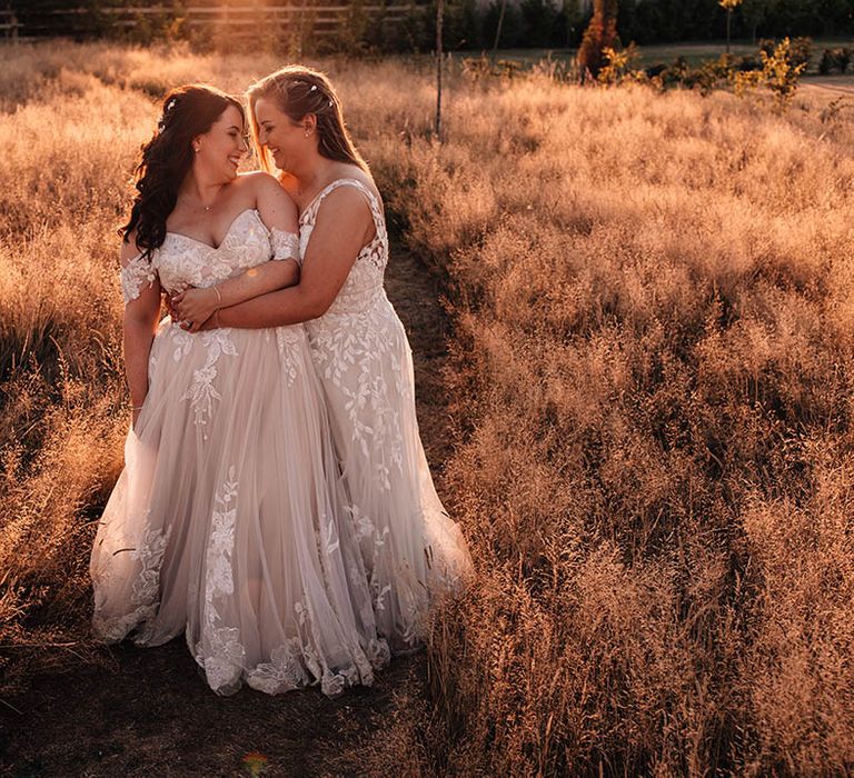 The Oakwood at Ryther barn wedding with the two brides posing out at golden hour for their couple portraits 