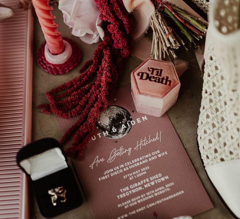 Pink wedding stationery with disco balls, a custom pink velvet ring box and retro sunglasses 