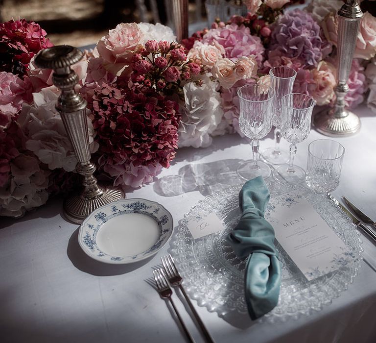 Light blue wedding napkin and pastel flower table runner 