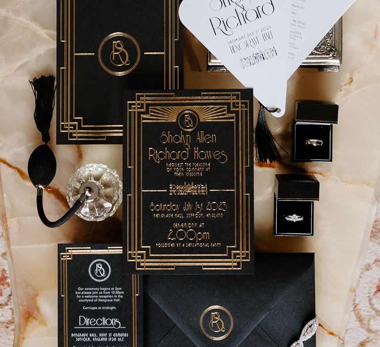 Great Gatsby theme wedding with black and gold art deco inspired wedding stationery 