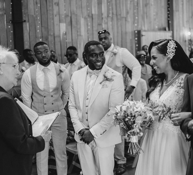 Father of the bride walks the bride down the aisle to meet the groom at boho luxe wedding in Kent 