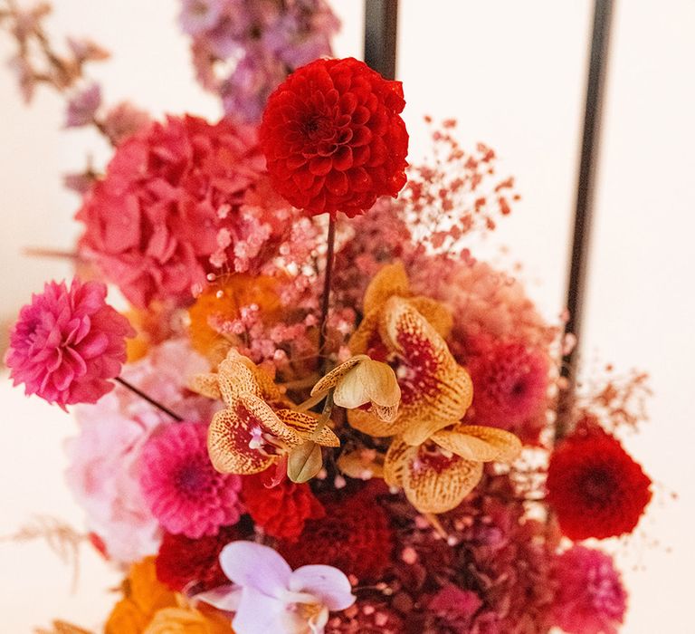 Pink, orange and yellow wedding flowers created by Honey Bunch London 