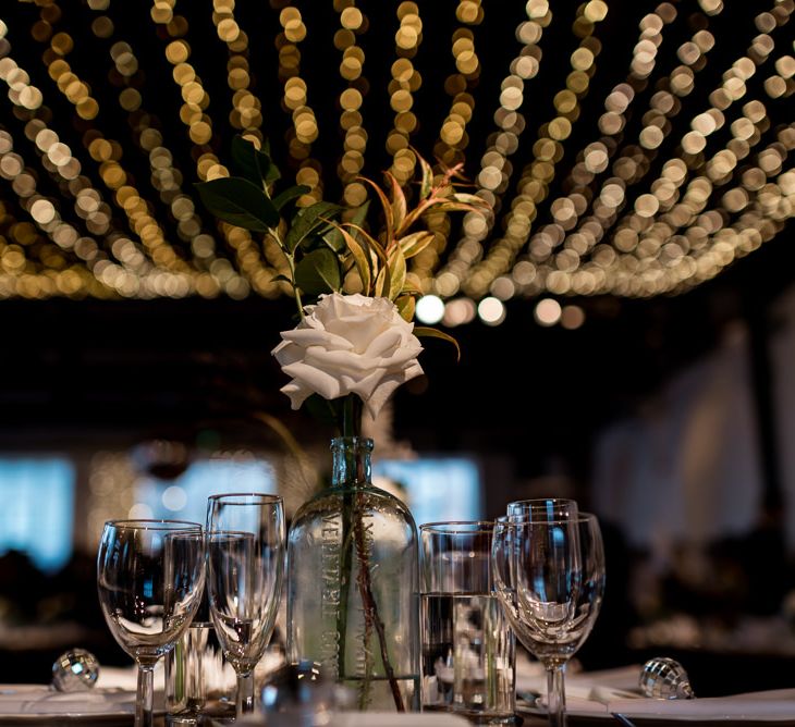 Fairy light canopy with white wedding flowers