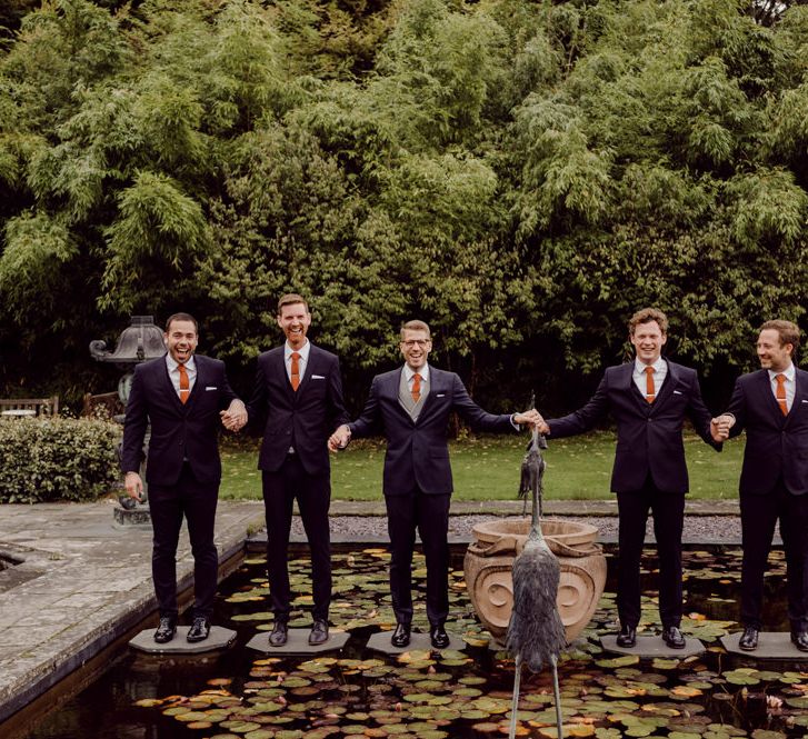 Groom with groomsmen at Larmer Tree Gardens Wedding