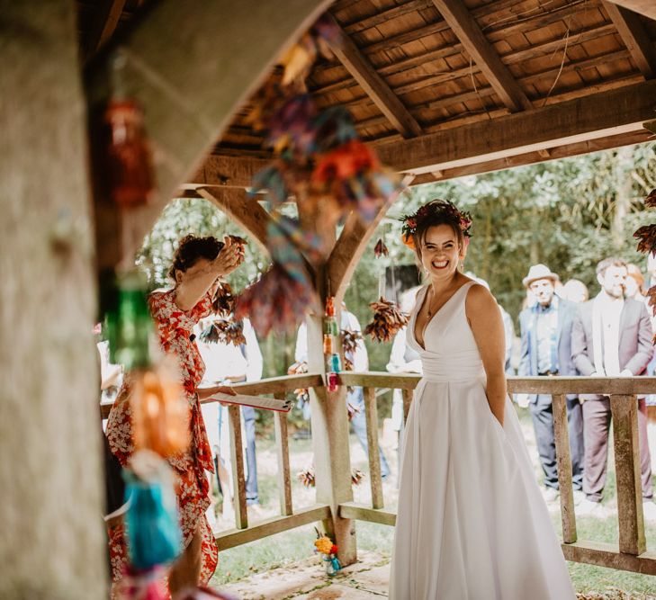 Happy bride in colourful flower crown