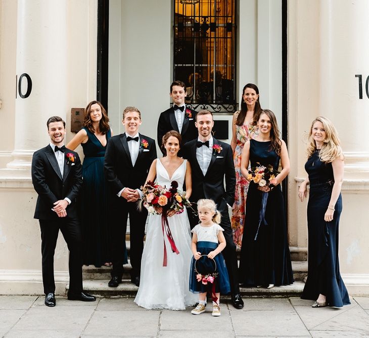 Wedding party gathered on the steps at Carlton House Terrace