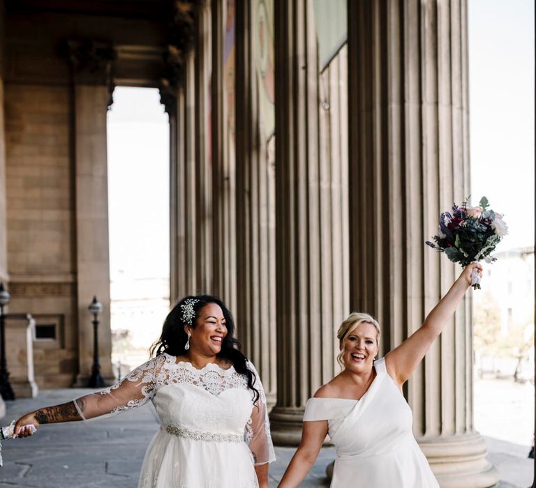 Brides celebrating at St Georges Hall Liverpool wedding