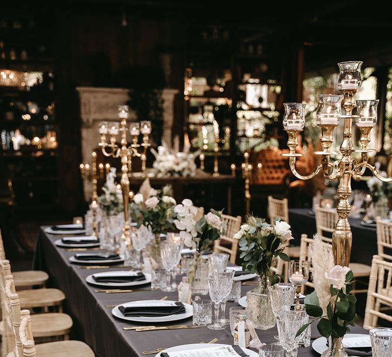 Dark tablecloths across tables for rock chic wedding reception