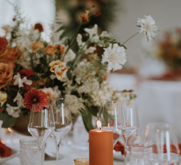 Orange pillar church candle wedding table decor