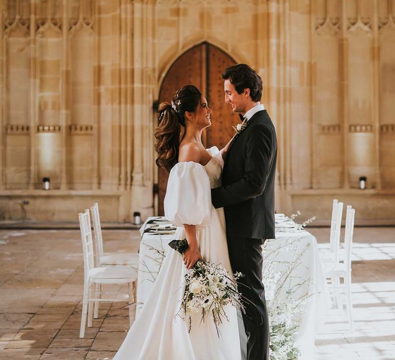 Sophisticated black tie wedding at Bodleian Library in Oxford with bride in a Nortier Shallow with a stylish ponytail up do 