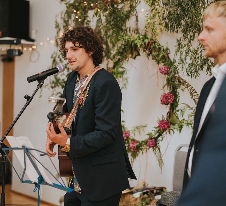 Guitarist sings for beach wedding in Devon