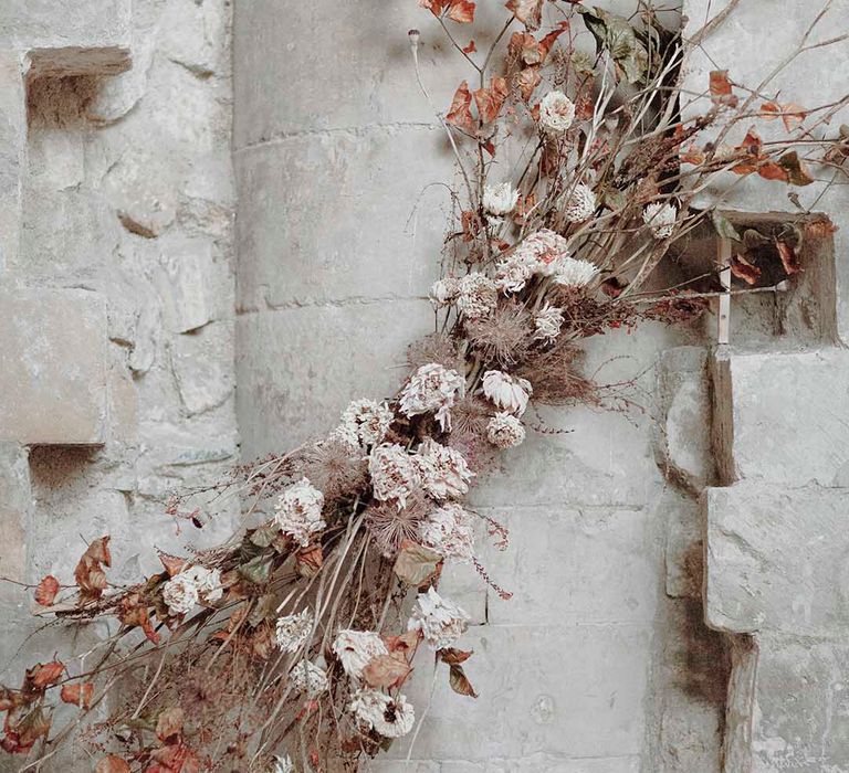 Dried flowers, twigs and foliage wedding flower arrangement at gothic wedding inspiration 