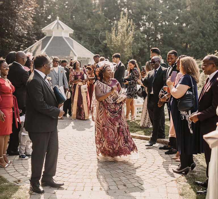 Wedding guests at Hayne House outdoors during summer wedding 