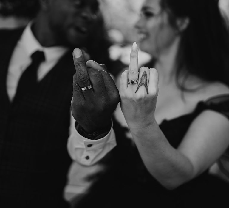 Bride & groom show off wedding rings after ceremony