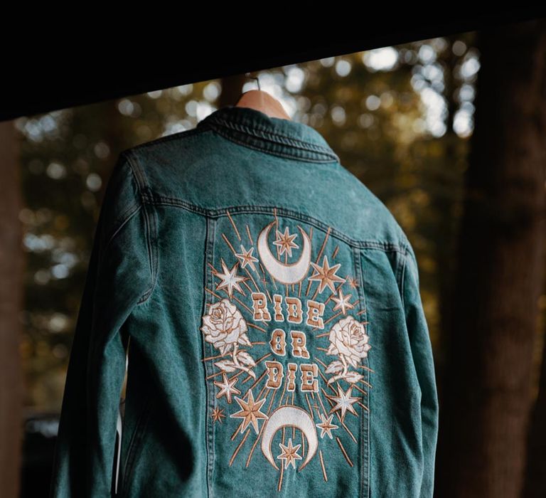 Embroidered custom wedding denim jacket cover-up with moon and rose designs 