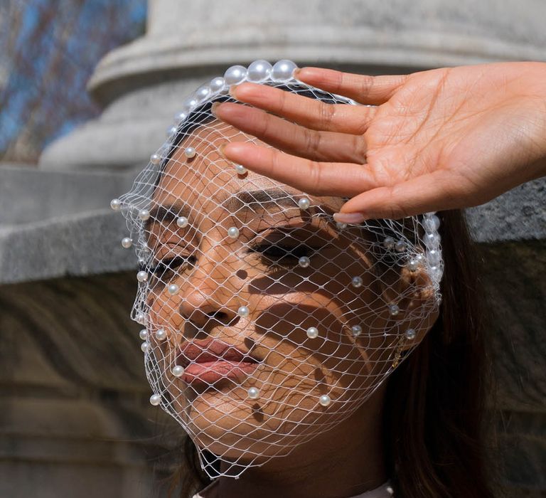 Bride wearing personalised pearl bird cage fascinator by Bonito & Grace 