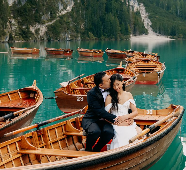 The happy couple ride on row boats on the lake 