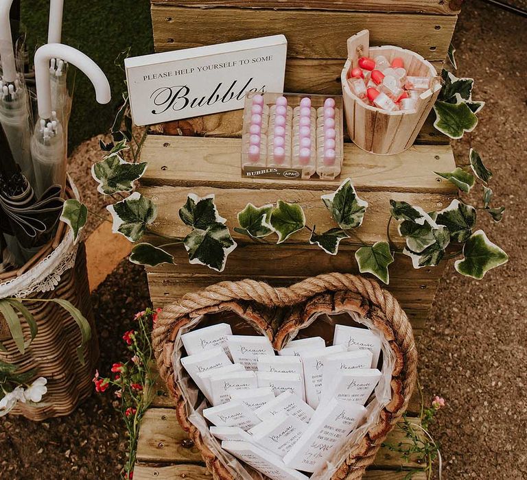 Sentimental wedding entertainment ideas including personalised tissues, bubbles and umbrellas 