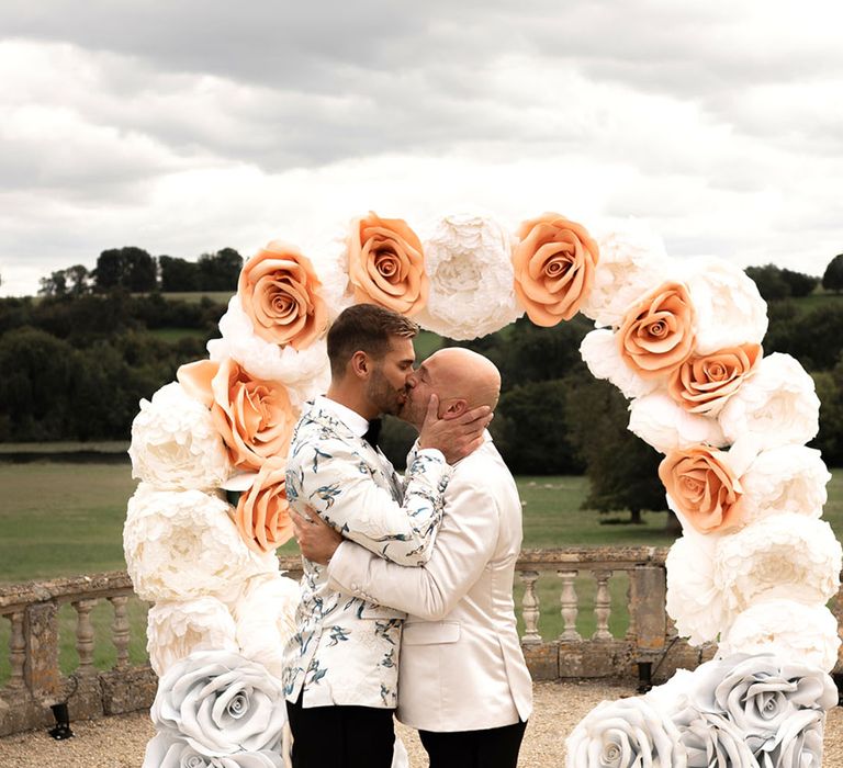 Cream and orange handmade rose altar decoration for country house outdoor wedding with the grooms participating in same sex wedding 