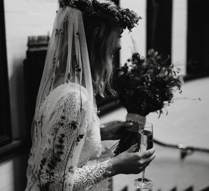 Boho bride with flower crown, and embroidered veil 