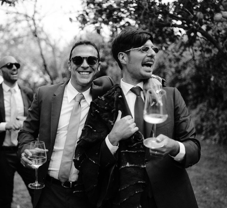 Groom with wedding guests 