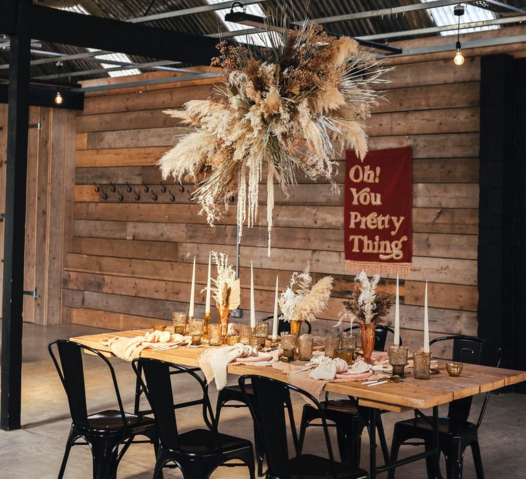 Dried flower installation at industrial tablescape