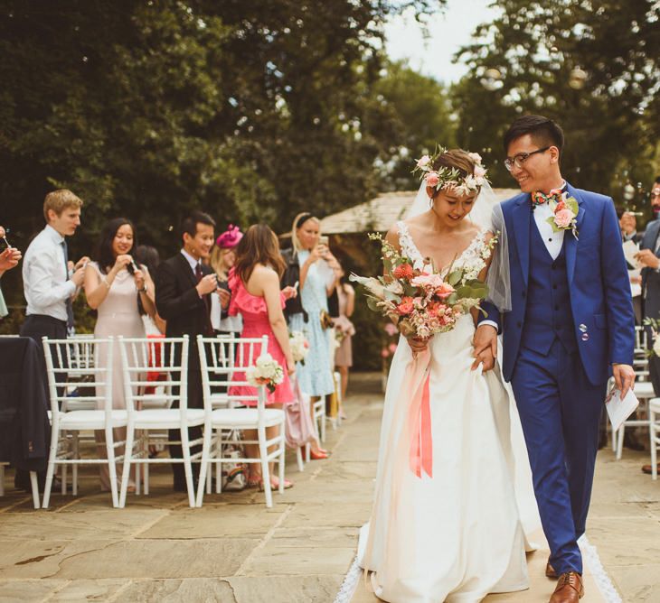 Bride and groom just married at outdoor wedding ceremony 