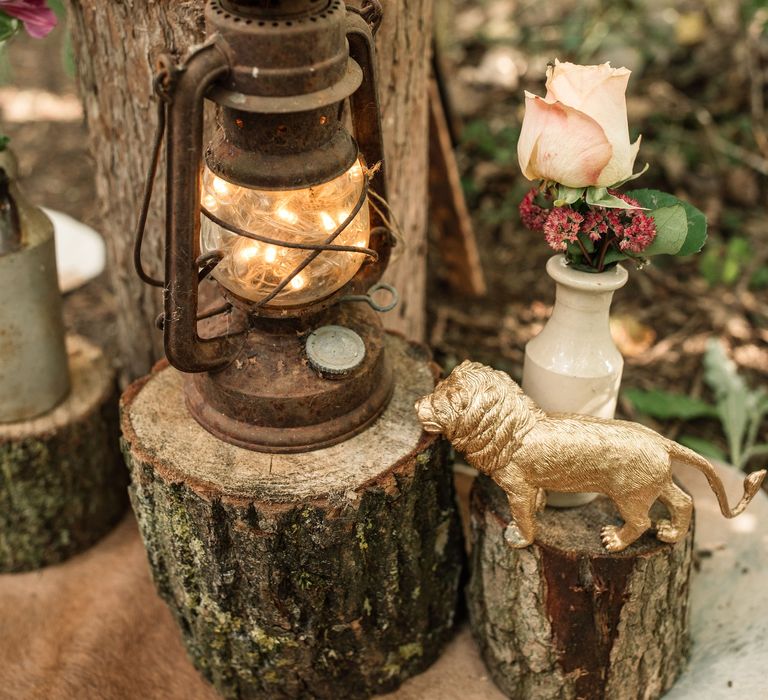 Wilderness inspired wedding decor with lamps filled with fairy lights