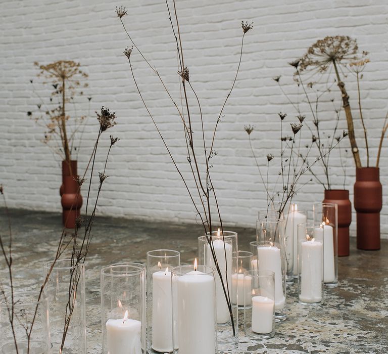 Pillar candles wedding aisle with dried flowers for industrial all white wedding