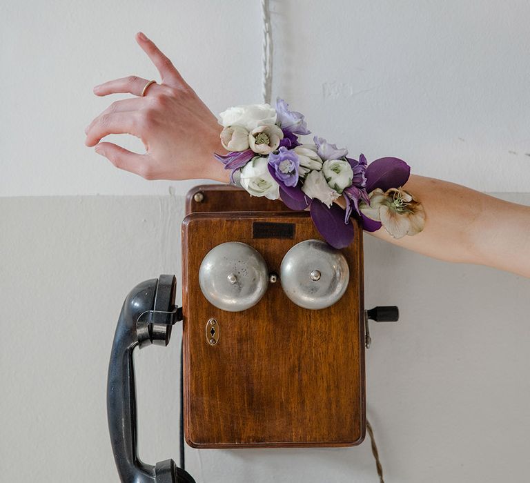 White and purple flower wrist corsage 