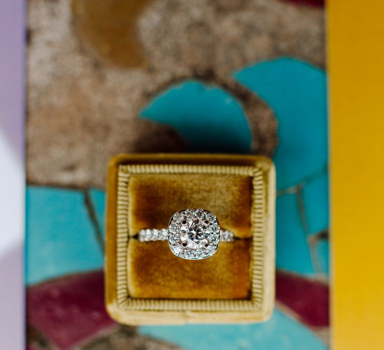 Diamond wedding ring with mustard velvet ring box