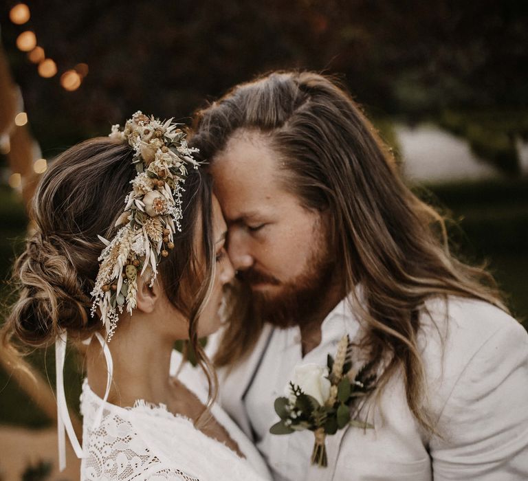 dried flower crown for boho bride in a lace wedding dress 