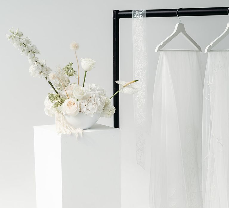 All white wedding flowers with David Austin Roses, hydrangeas, anthuriums and dahlias. 