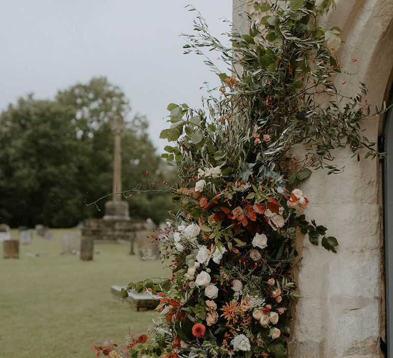 Amazing Autumnal flower decor at church wedding ceremony