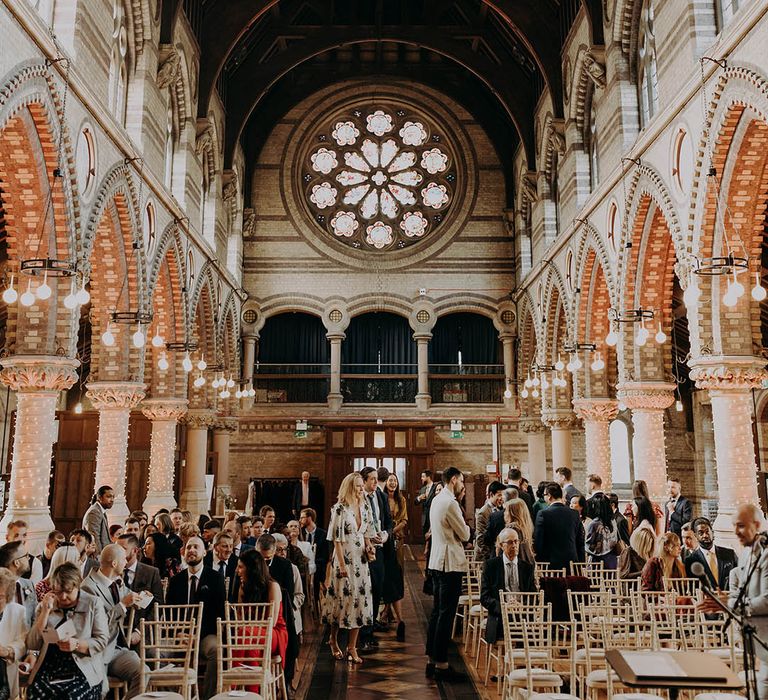  Wedding guests take their seats at church | Irene Yap Photography