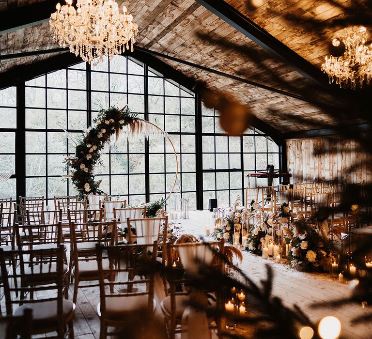 Chandelier and candle lit wedding venue at the Lake District for winter wedding with moongate