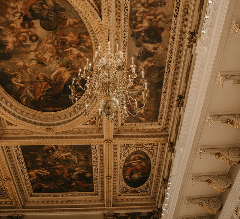 Painted ceiling with gold chandelier at The Banqueting House in Whitehall, London