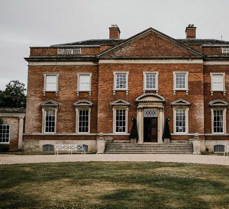 The outside and grounds of Kelmarsh Hall, country house wedding venue