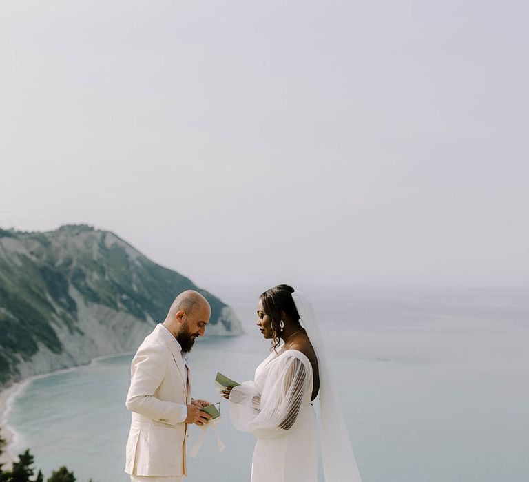 Bride and Groom share their vows privately in front of the sea in Portonovo, Italy